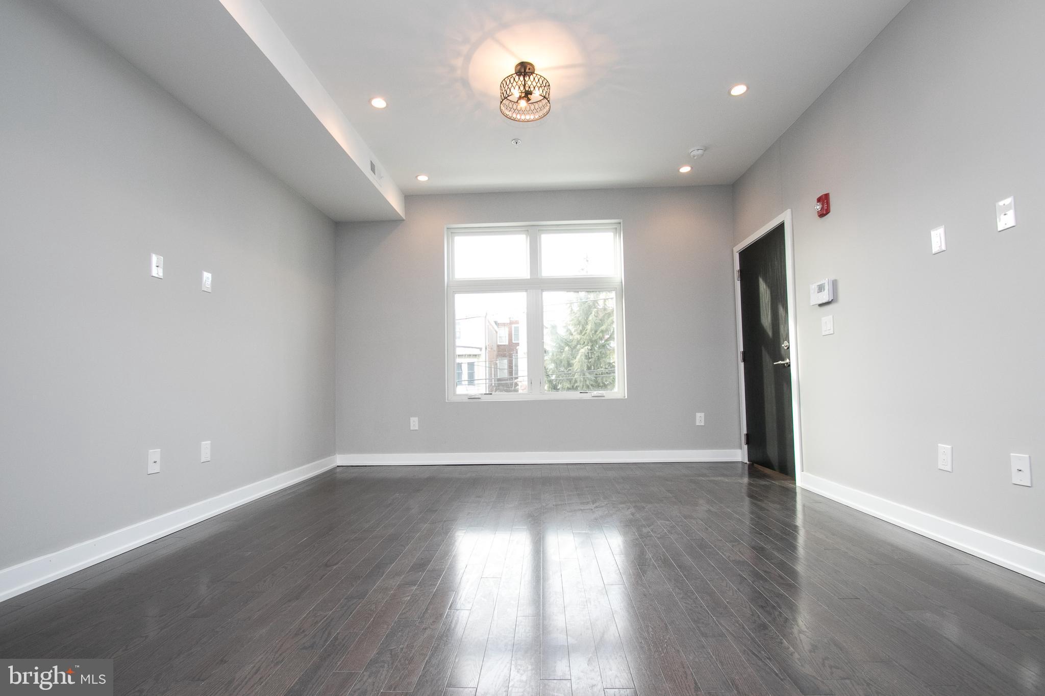 755 North Capitol Street Philadelphia, PA 19130 - Photo 33 of 47 an empty room with wooden floor and windows