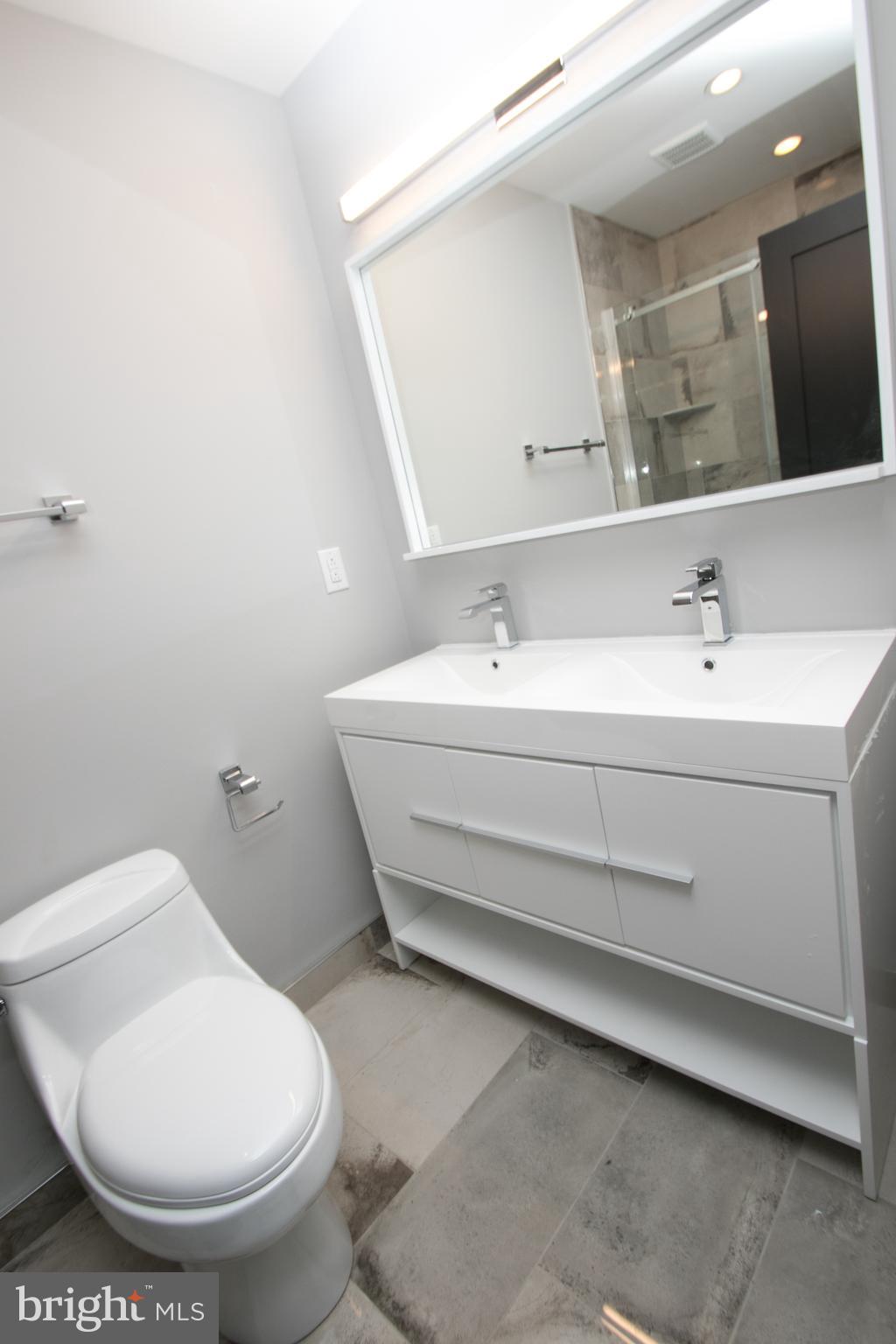 755 North Capitol Street Philadelphia, PA 19130 - Photo 38 of 47 a bathroom with a toilet sink and mirror