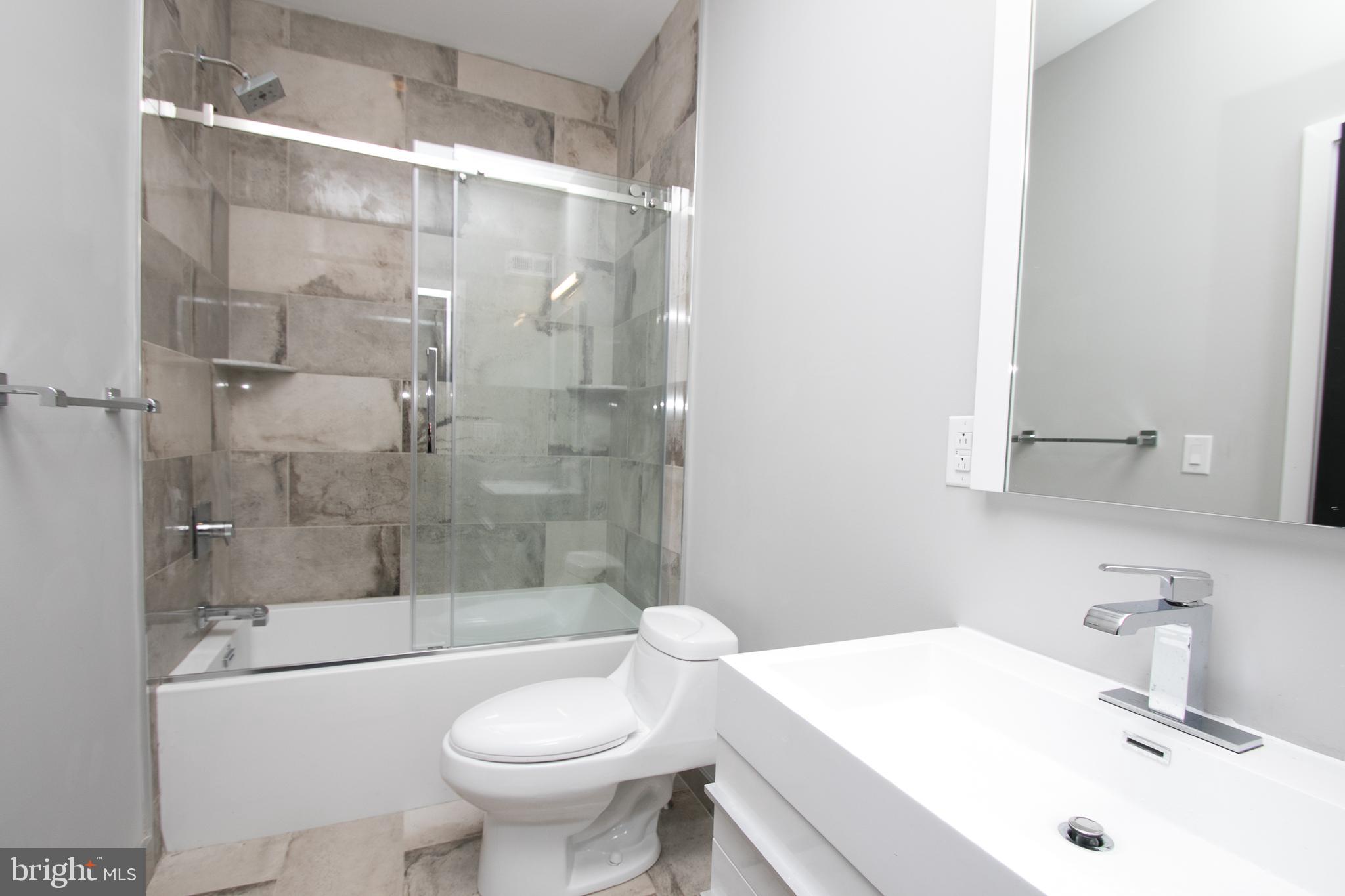 755 North Capitol Street Philadelphia, PA 19130 - Photo 8 of 47 a bathroom with a sink toilet and shower