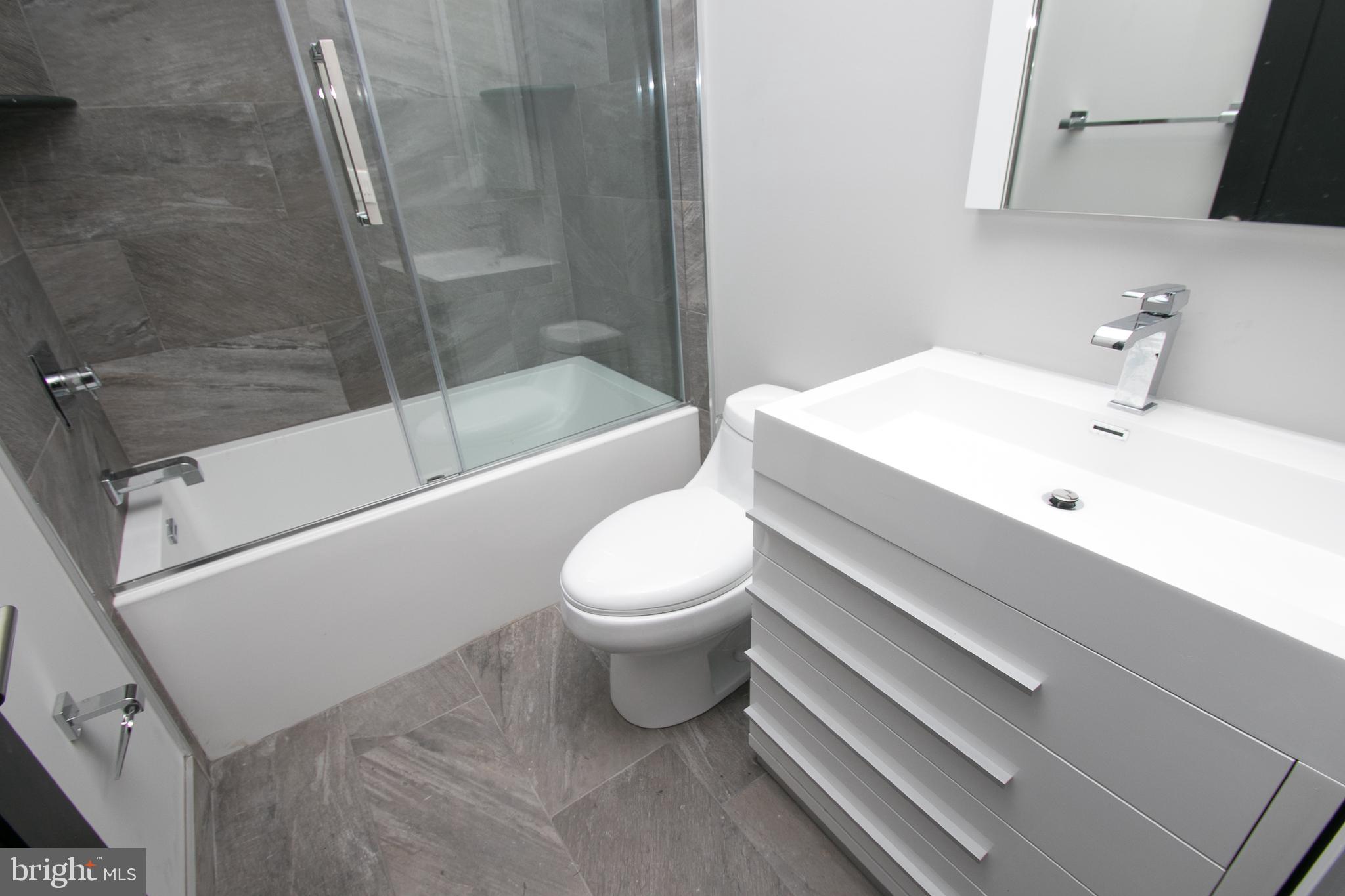 755 North Capitol Street Philadelphia, PA 19130 - Photo 10 of 47 a bathroom with a sink toilet and shower