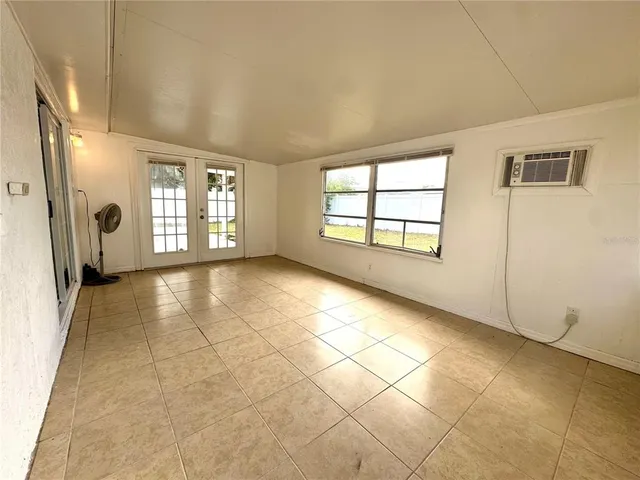 a view of an empty room with a window