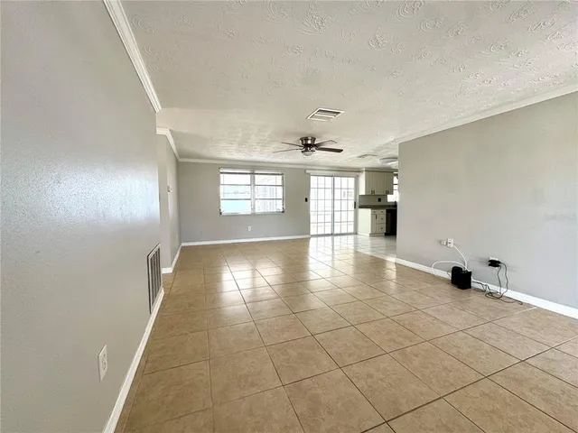 a view of an empty room with windows
