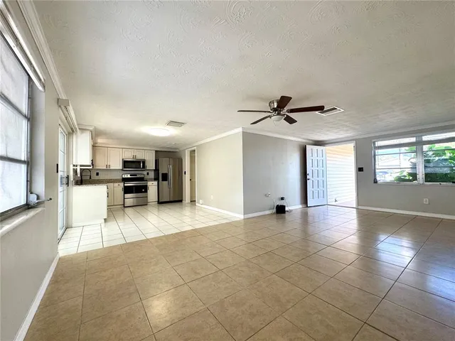 a view of a kitchen with a sink and a stove top oven