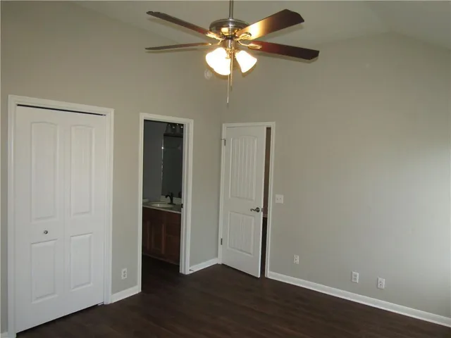 a view of a workspace with wooden floor