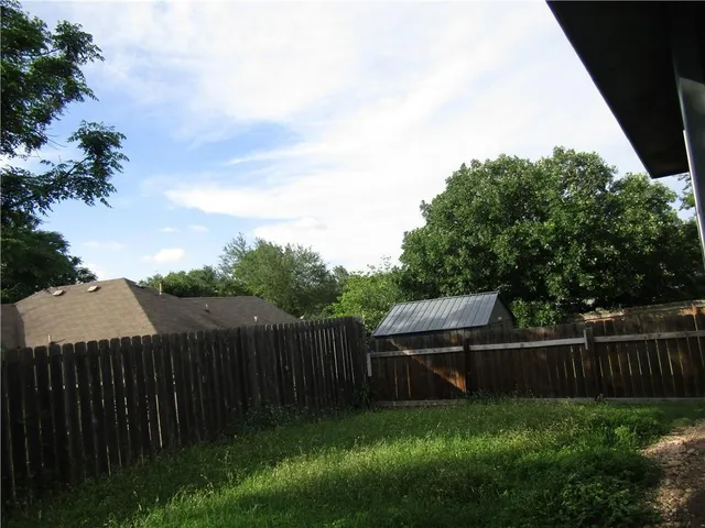 a view of a backyard with a small cabin