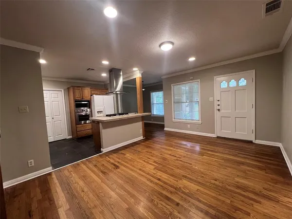 a view of kitchen with wooden floor