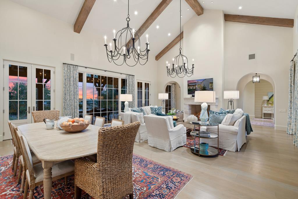 1691 Cool Water Ranch Road Fredericksburg, TX 78624 - Photo 14 of 33 a view of a dining room with furniture a chandelier and wooden floor
