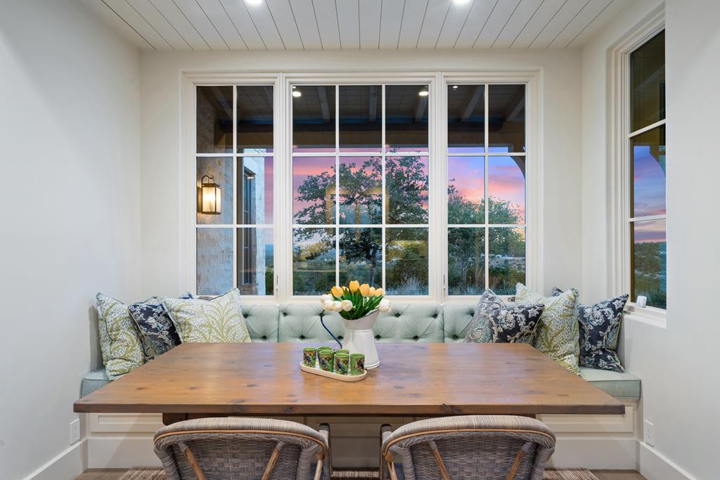 1691 Cool Water Ranch Road Fredericksburg, TX 78624 - Photo 18 of 33 a view of a dining room with furniture window and wooden floor