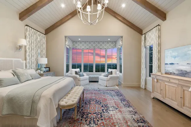 a spacious bathroom with a double vanity sink mirror and shower