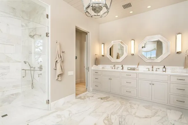 a living room with furniture a fireplace and wooden floor