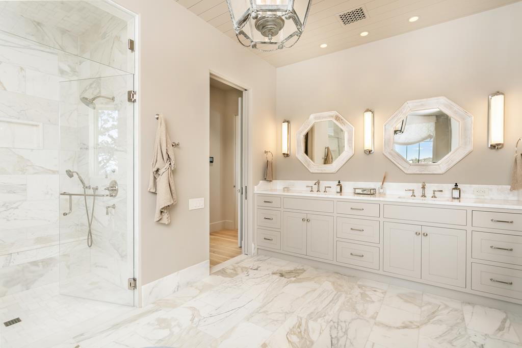 1691 Cool Water Ranch Road Fredericksburg, TX 78624 - Photo 21 of 33 a spacious bathroom with a double vanity sink mirror and shower