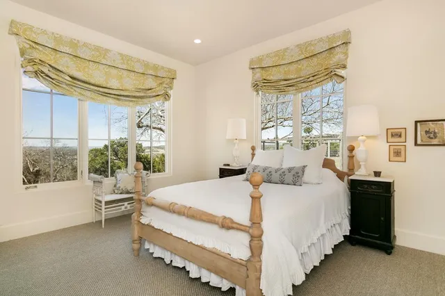 a bed room with a bed and a window