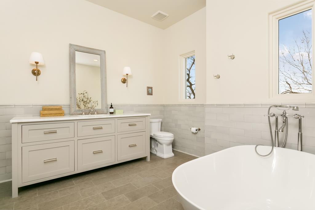 1691 Cool Water Ranch Road Fredericksburg, TX 78624 - Photo 26 of 33 a bathroom with a double vanity sink a mirror and shower