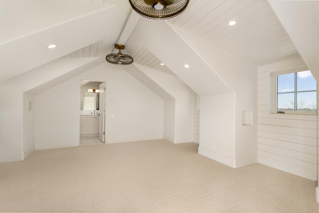 1691 Cool Water Ranch Road Fredericksburg, TX 78624 - Photo 29 of 33 an empty room with wooden floor and windows