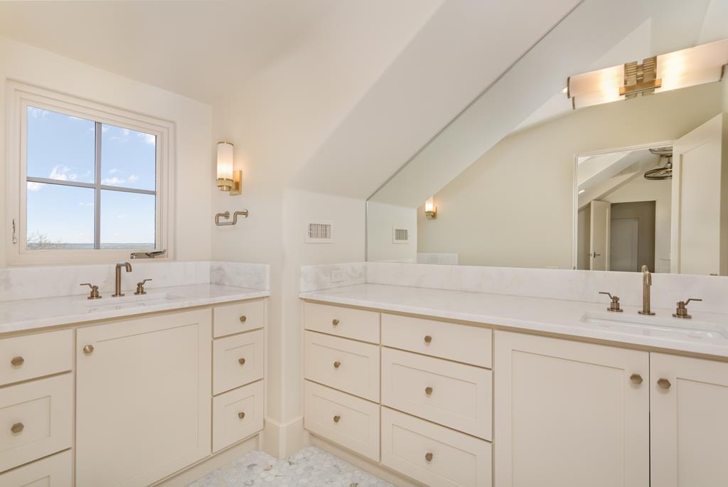 1691 Cool Water Ranch Road Fredericksburg, TX 78624 - Photo 30 of 33 a bathroom with a granite countertop sink mirror and double