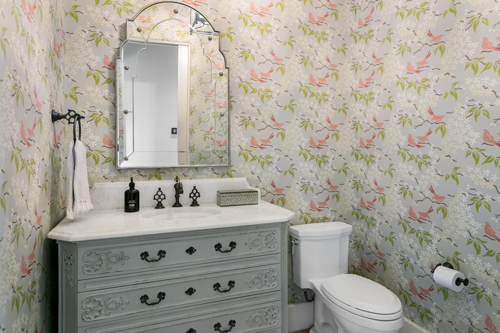 1691 Cool Water Ranch Road Fredericksburg, TX 78624 - Photo 32 of 33 a bathroom with a granite countertop toilet sink and mirror