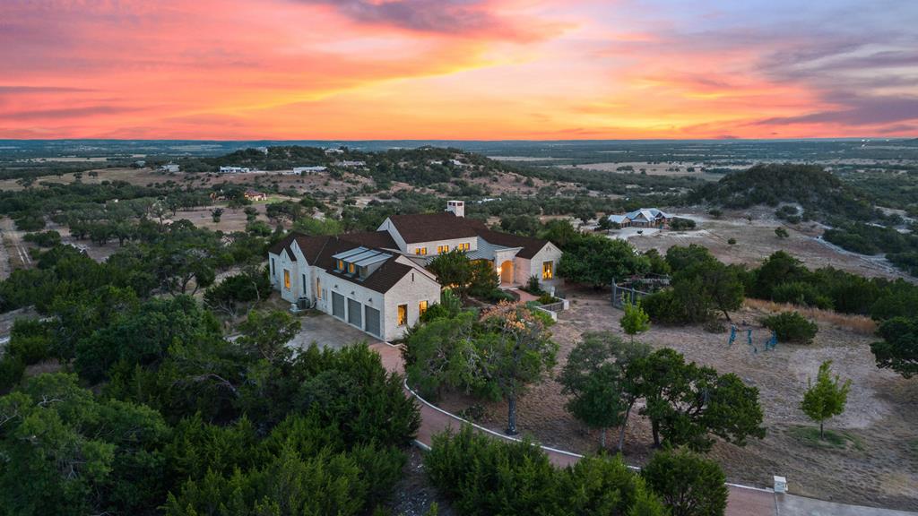1691 Cool Water Ranch Road Fredericksburg, TX 78624 - Photo 7 of 33 a view of a city with tall buildings in background