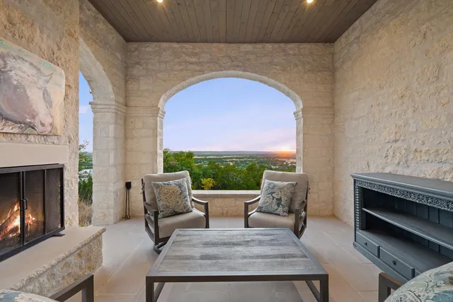 a view of a hallway with wooden floor and dining room