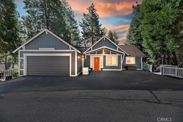 a front view of a house with yard