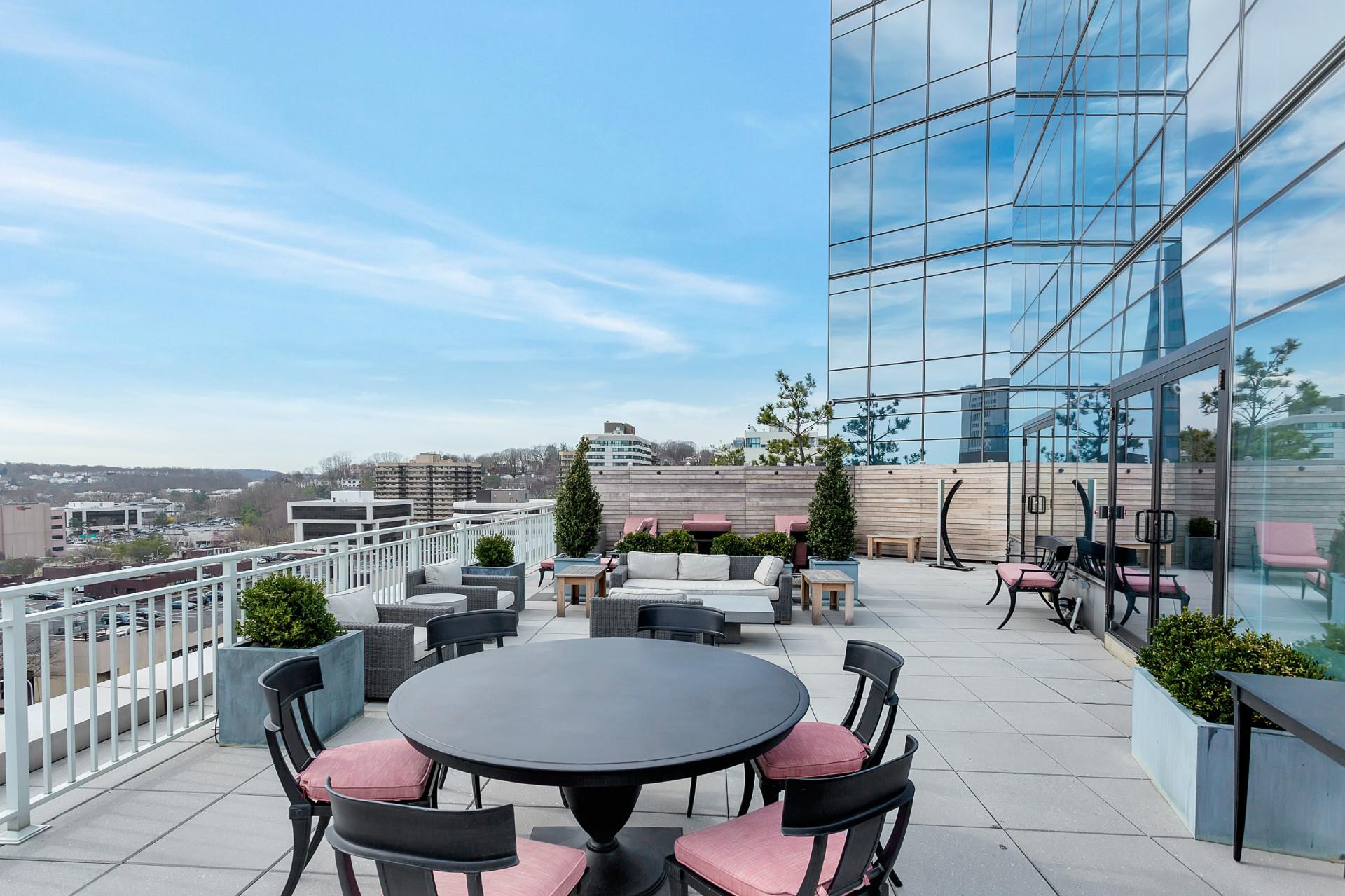 5 Renaissance Square, Unit PH41C White Plains, NY 10601 - Photo 21 of 24 a terrace with outdoor seating and city view