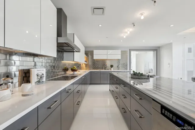 a large kitchen with stainless steel appliances lots of counter top space