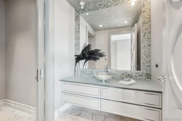 a bathroom with a sink and a mirror