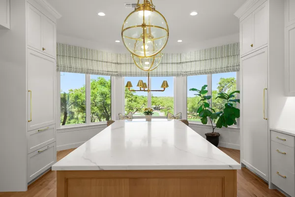a view of kitchen with furniture and a window