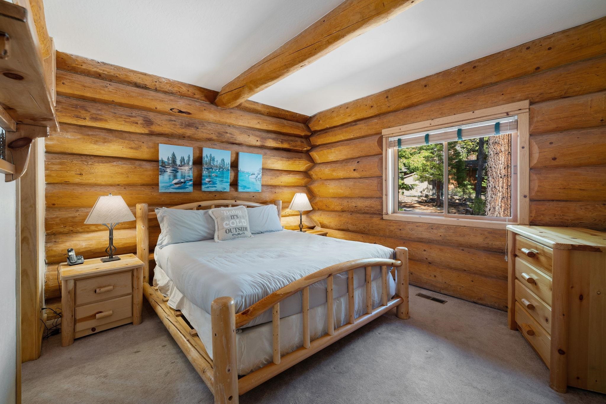 7883 Mashie Avenue Tahoe Vista, CA 96148 - Photo 12 of 28 a bed sitting in a bedroom next to a window