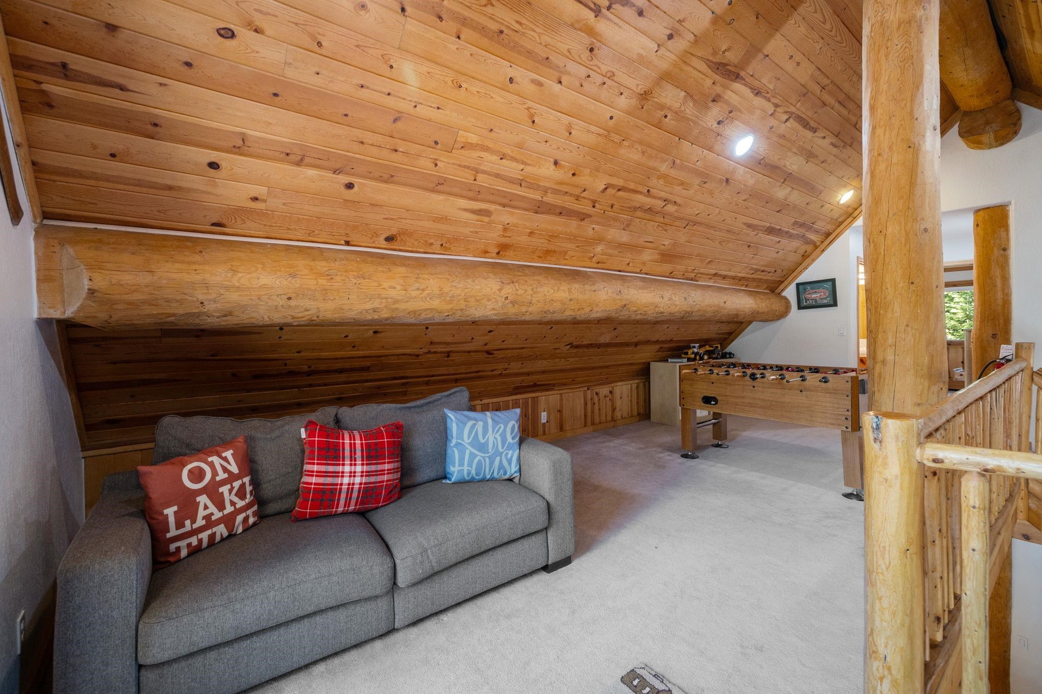 7883 Mashie Avenue Tahoe Vista, CA 96148 - Photo 18 of 28 a living room with furniture and a fireplace