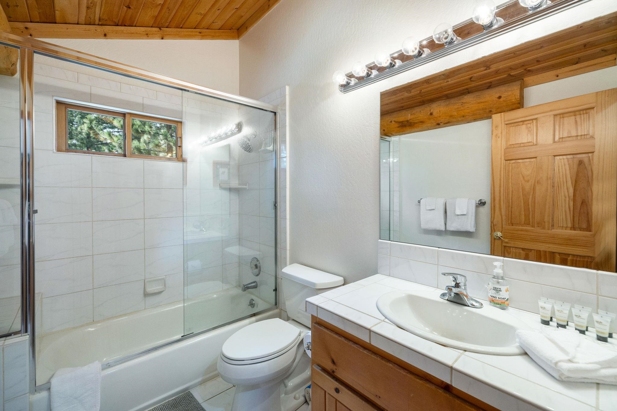 7883 Mashie Avenue Tahoe Vista, CA 96148 - Photo 21 of 28 a bathroom with a sink a toilet and shower