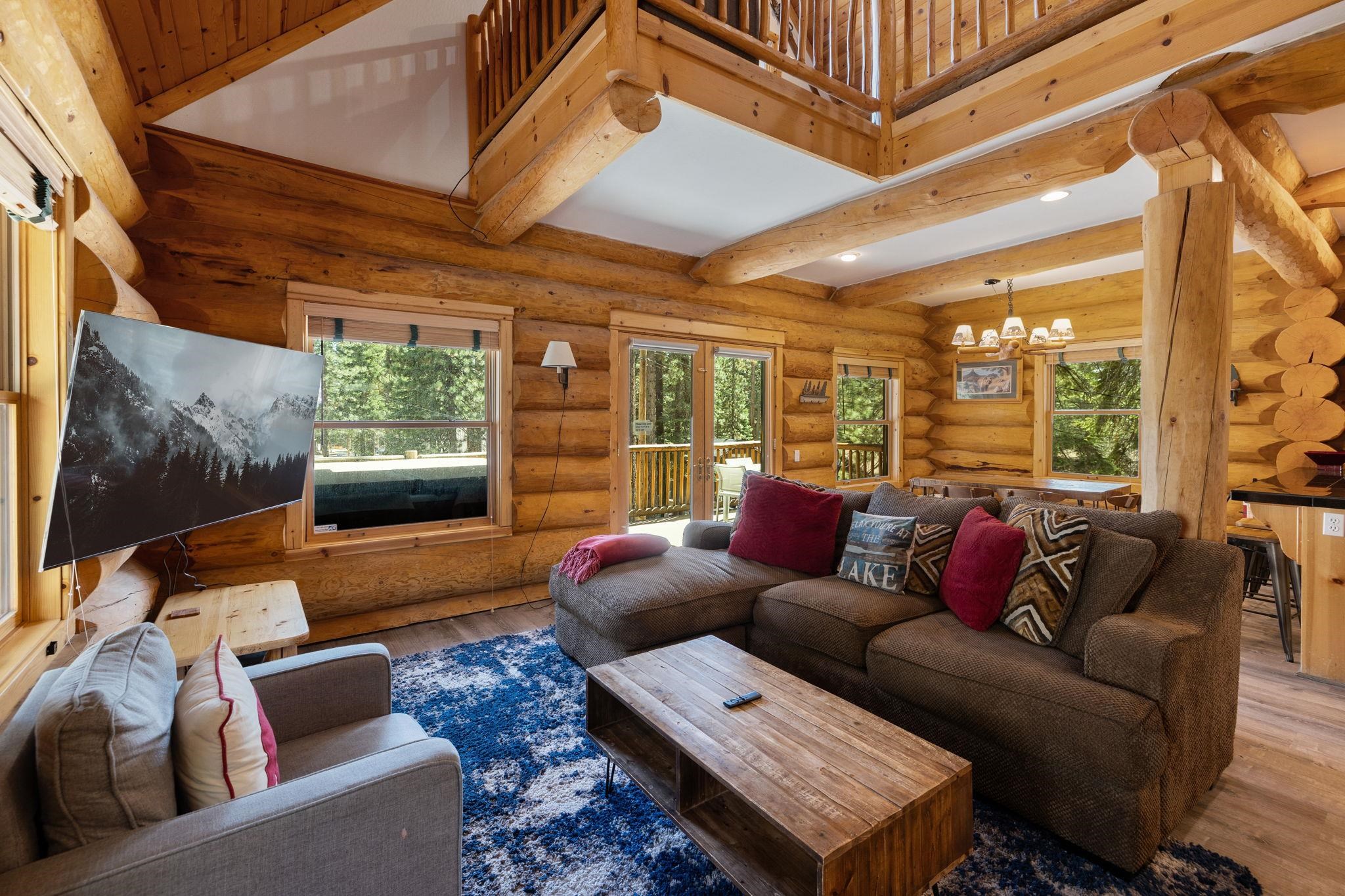 7883 Mashie Avenue Tahoe Vista, CA 96148 - Photo 6 of 28 a living room with furniture and a floor to ceiling window