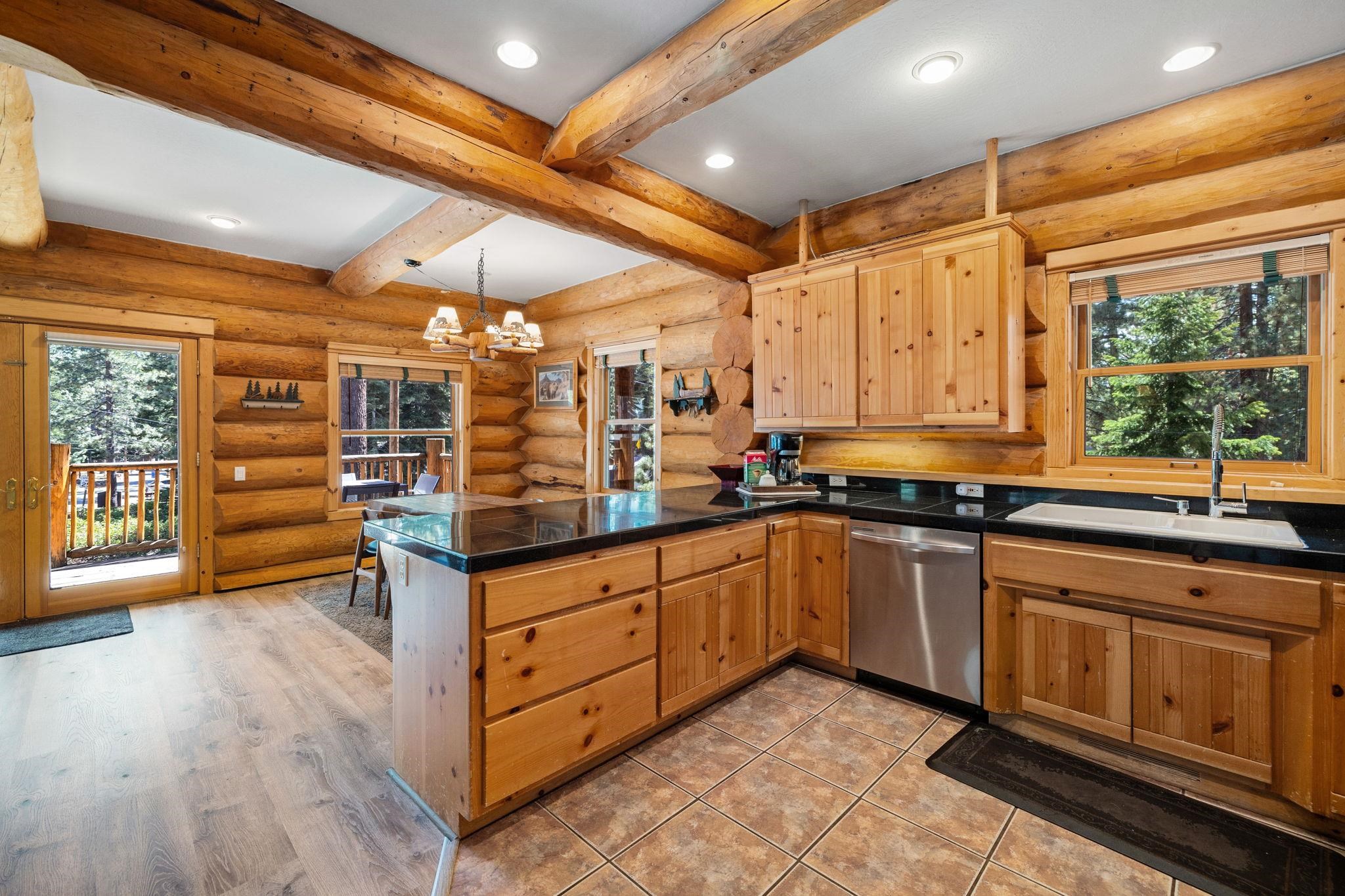 7883 Mashie Avenue Tahoe Vista, CA 96148 - Photo 8 of 28 a kitchen with stainless steel appliances granite countertop a sink and cabinets