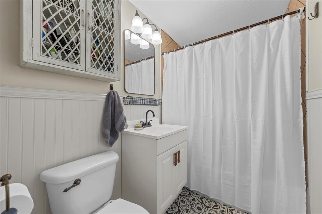 2216 Hermanson Drive Waco, TX 76710 - Photo 24 of 39 a bathroom with a toilet sink and vanity