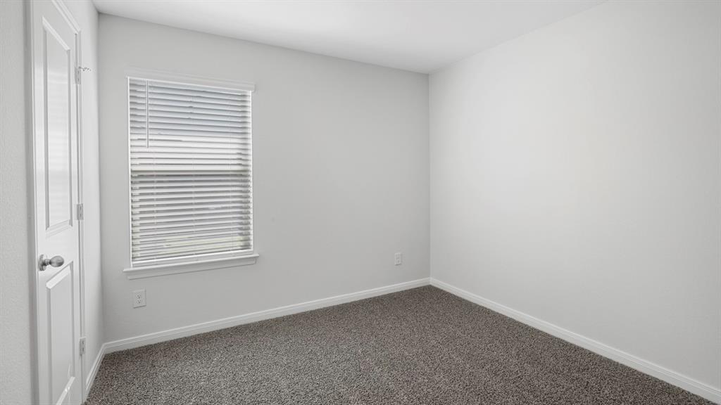 1921 Reveille Way Terrell, TX 75160 - Photo 7 of 30 an empty room with a window