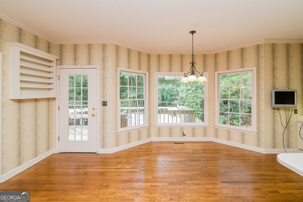 106 Baymeadow Point Savannah, GA 31405 - Photo 20 of 30 a view of an empty room with a window and wooden floor