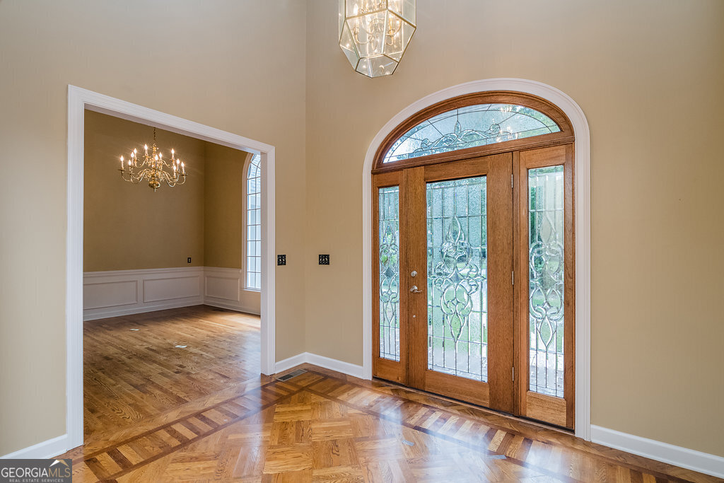 106 Baymeadow Point Savannah, GA 31405 - Photo 2 of 30 an empty room with window mirror and fan