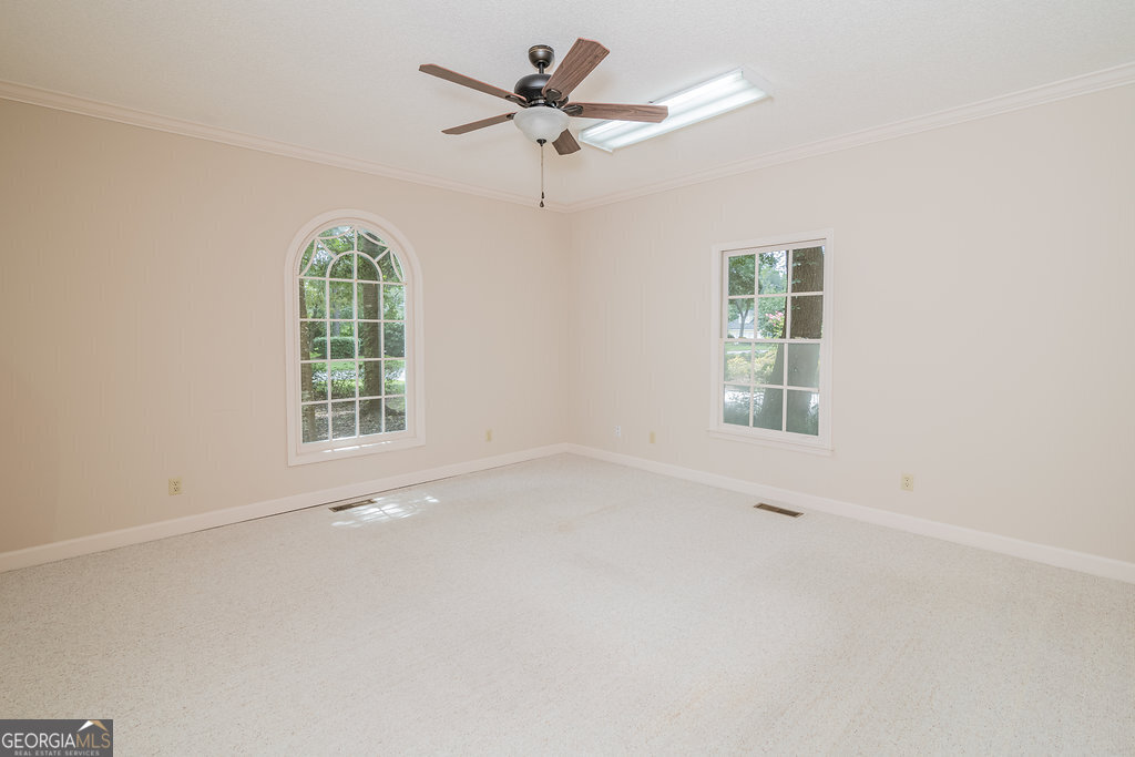 106 Baymeadow Point Savannah, GA 31405 - Photo 30 of 30 an empty room with a window and a fan