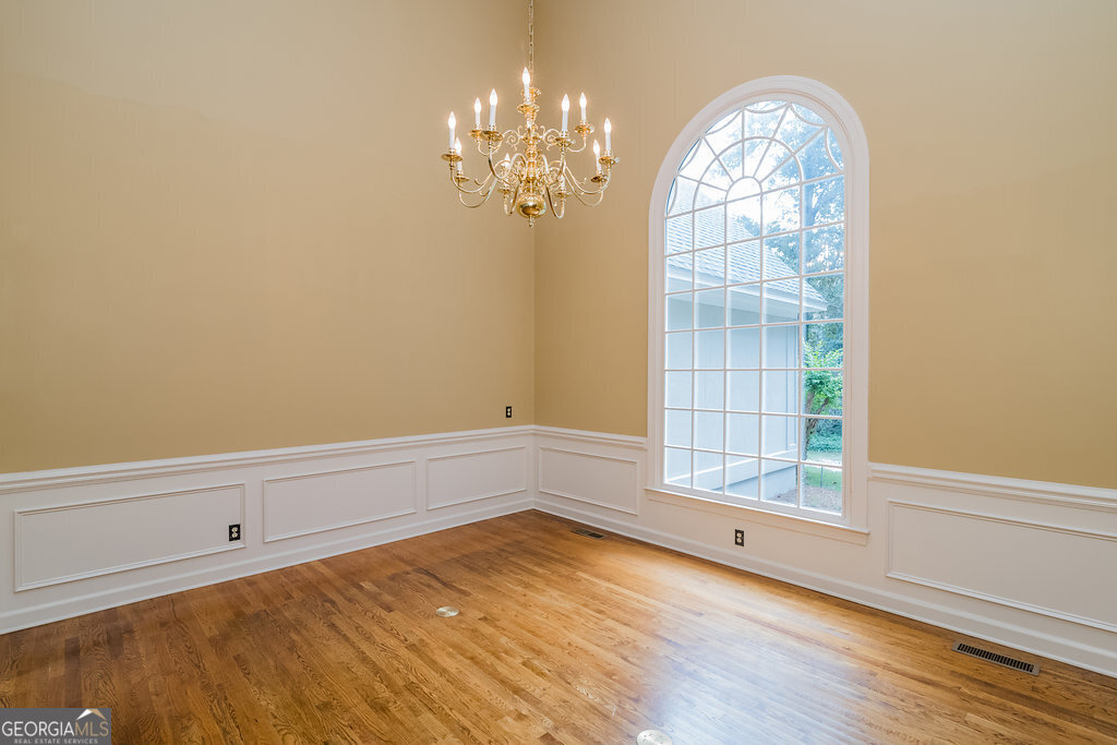 106 Baymeadow Point Savannah, GA 31405 - Photo 3 of 30 a view of empty room with wooden floor and fan