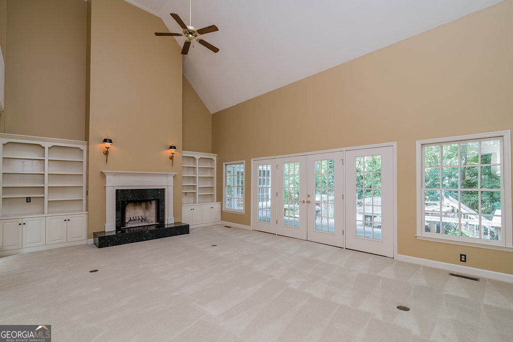 106 Baymeadow Point Savannah, GA 31405 - Photo 6 of 30 a view of an empty room with a fireplace and a window