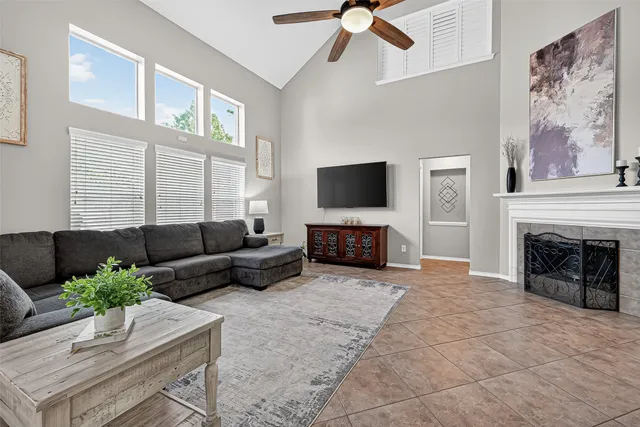 a living room with furniture and a fireplace