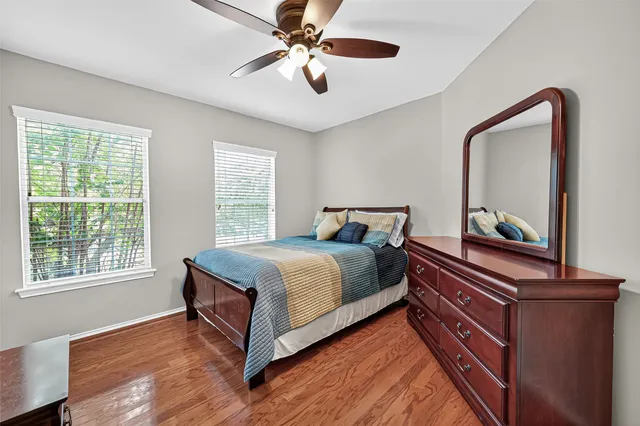 a bathroom with a sink a toilet and shower curtain