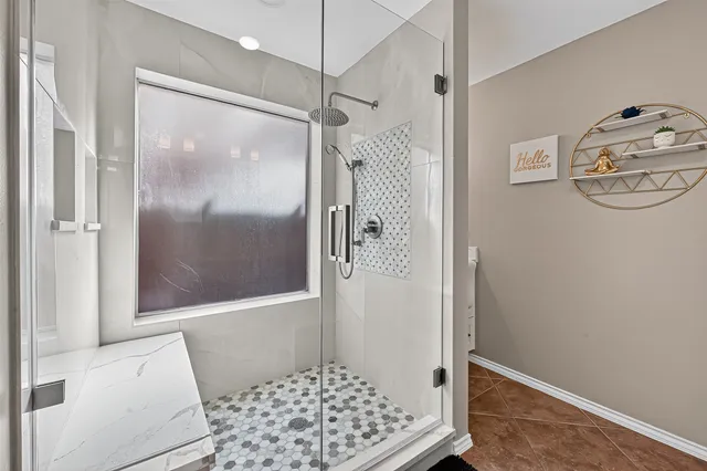 a bathroom with a shower and a toilet