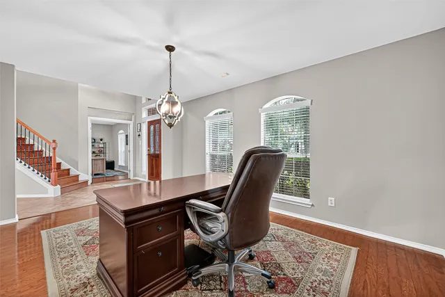a dining room with furniture and window