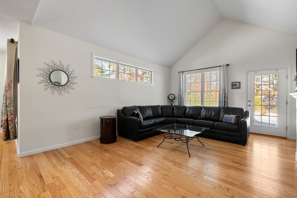 44 Mariners Way, Unit 44 Plymouth, MA 02360 - Photo 12 of 36 a living room with furniture and a wooden floor