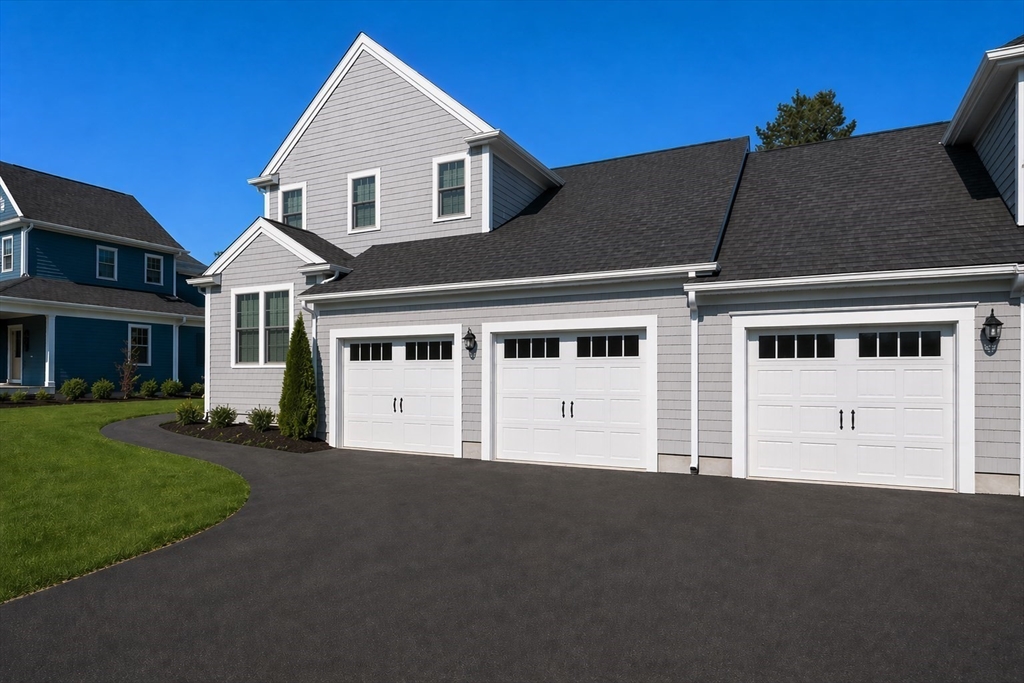44 Mariners Way, Unit 44 Plymouth, MA 02360 - Photo 2 of 36 a front view of a house with a garden