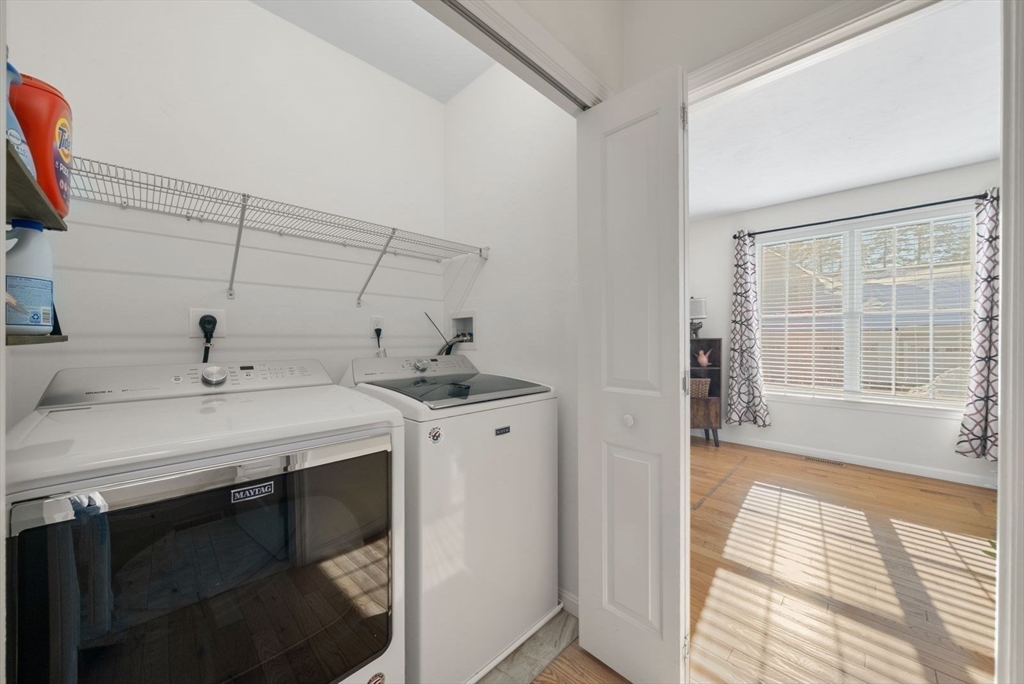 44 Mariners Way, Unit 44 Plymouth, MA 02360 - Photo 23 of 36 a utility room with cabinets washer and dryer
