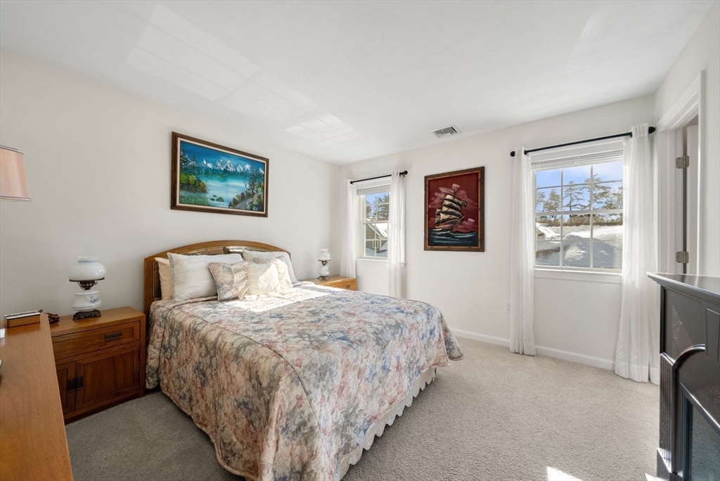 44 Mariners Way, Unit 44 Plymouth, MA 02360 - Photo 26 of 36 a bedroom with a bed and a window