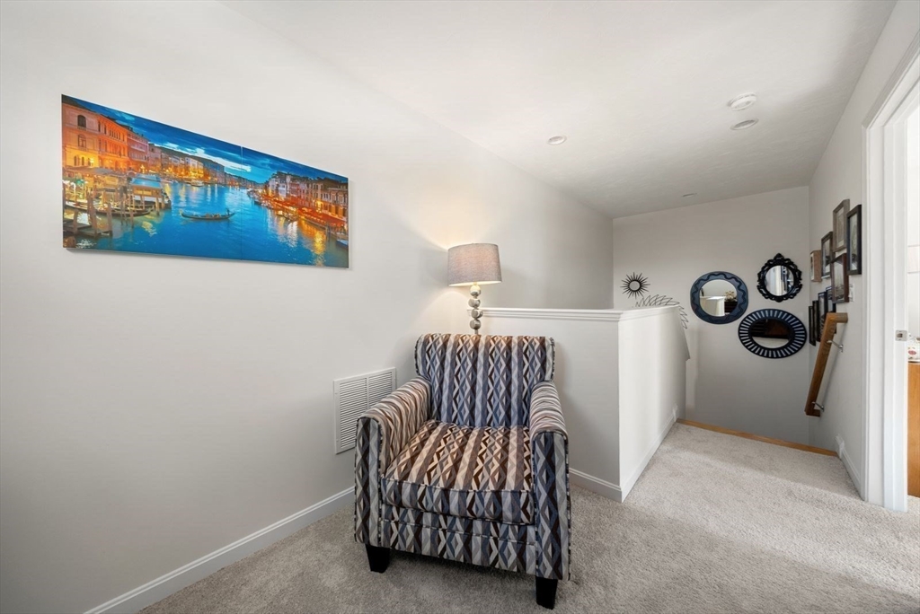 44 Mariners Way, Unit 44 Plymouth, MA 02360 - Photo 30 of 36 a bedroom with a bed and a painting on the wall