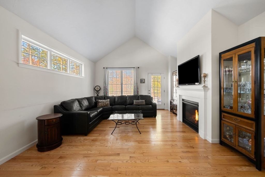 44 Mariners Way, Unit 44 Plymouth, MA 02360 - Photo 10 of 36 a living room with furniture and a flat screen tv