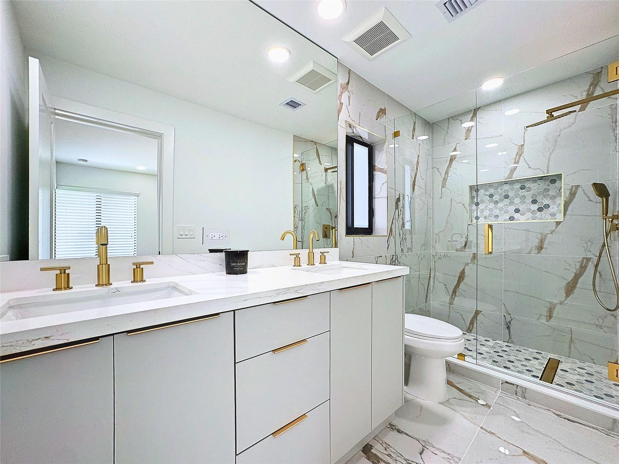 17732 Briar Patch Trail Boca Raton, FL 33487 - Photo 13 of 27 a bathroom with a double vanity sink mirror and toilet
